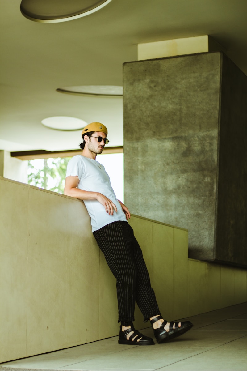 man leaning against wall